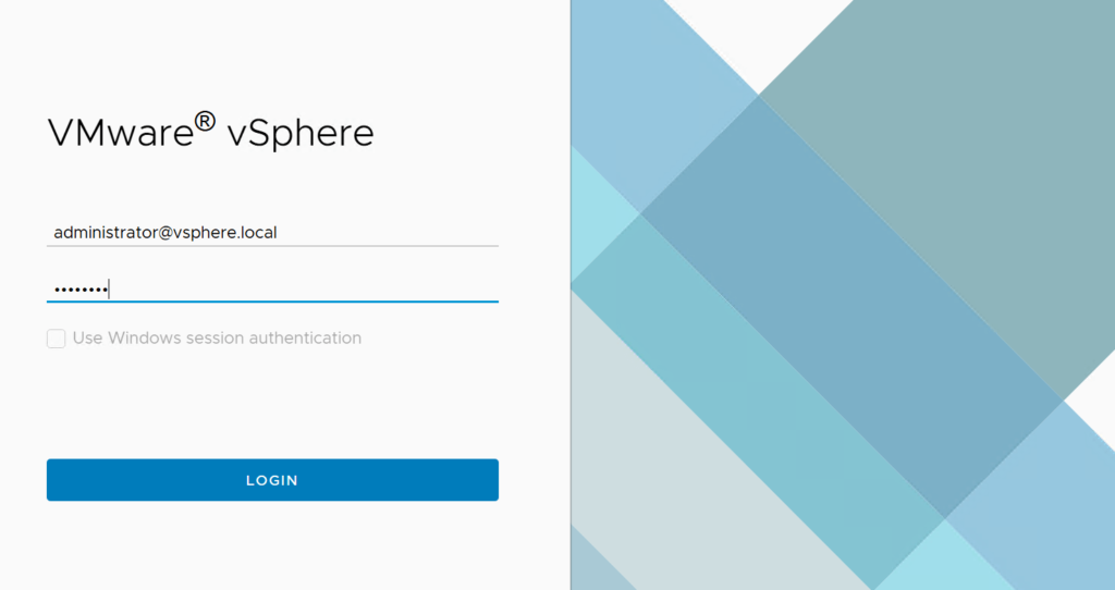 WMware vCenter Login Login screen for VMware vSphere. The left side shows fields to enter a username, administrator@vsphere.local, and a password, displayed as dots. Below is a checkbox for Use Windows session authentication. A blue LOGIN button is at the bottom. The right side features a blue geometric design.